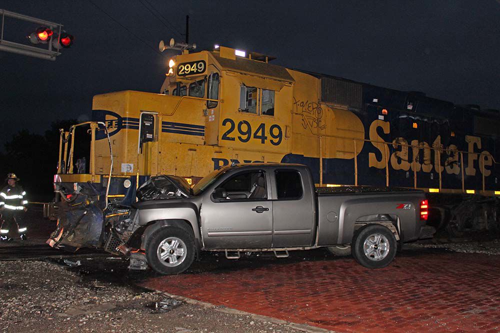 Driver flees after train versus truck crash